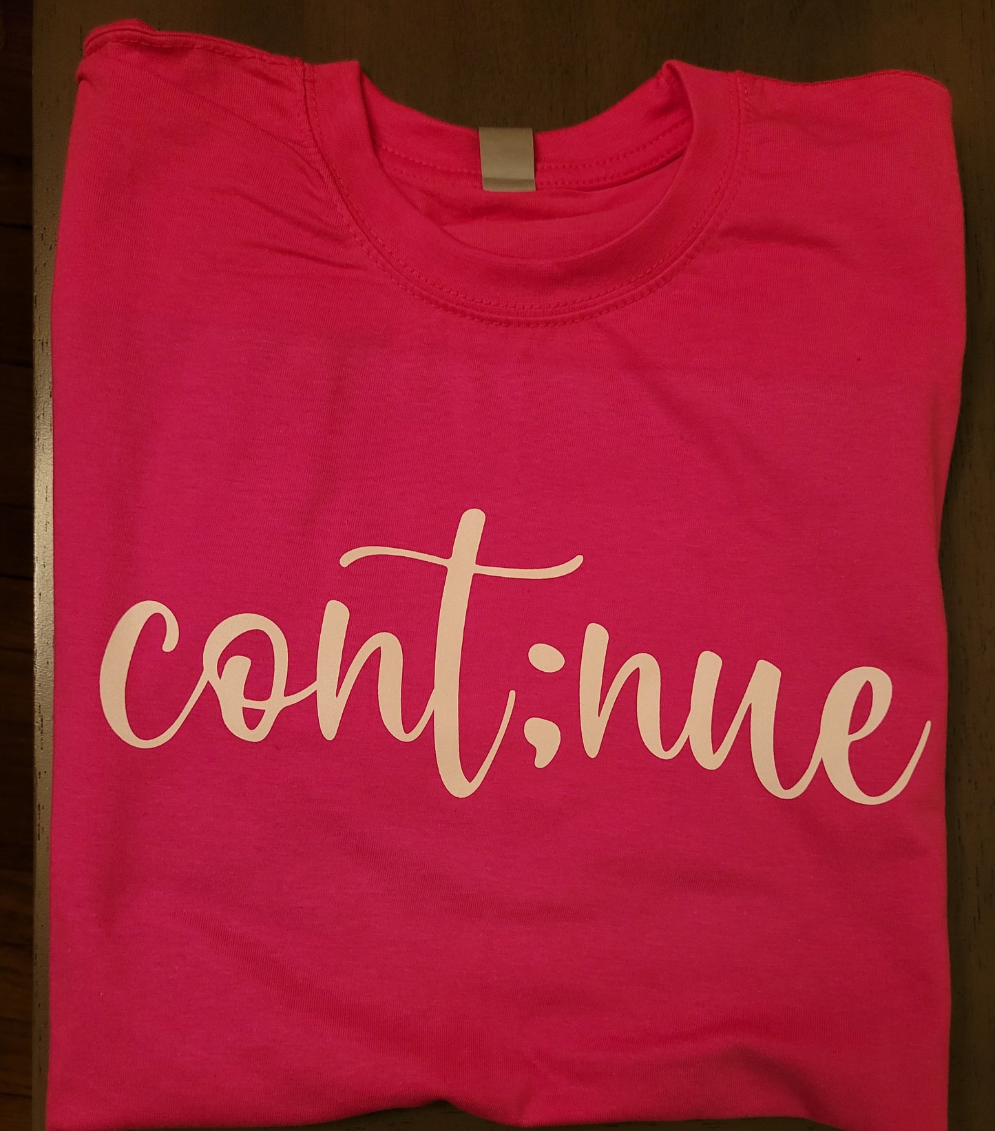 Cont;nue Tee